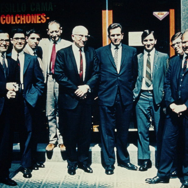 a photo of Pres. Smith Griffin, Elder Boyd K. Packer, the Barcelona missionaries, and early convert Hno. Valls on the sidewalk in front of the Barcelona chapel